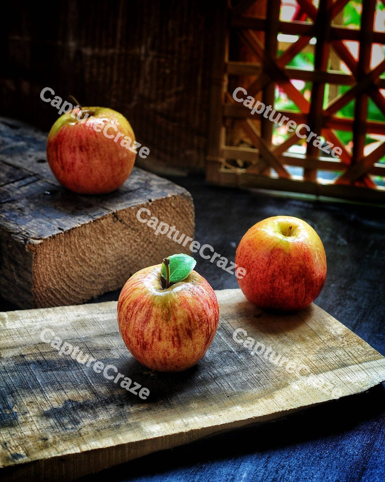 Three red apples